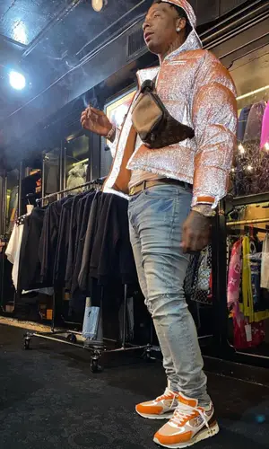 Moneybagg Yo wearing Louis Vuitton bag