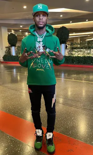 Toosii wearing Ricchezza Forever hoody