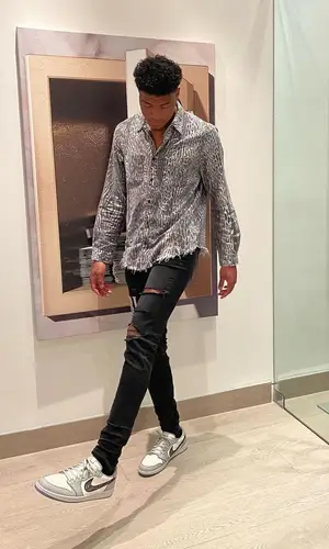 Rui Hachimura wearing Amiri jeans