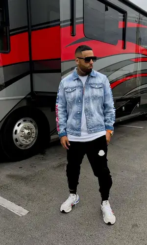 Nicky Jam wearing Dsquared2 jacket