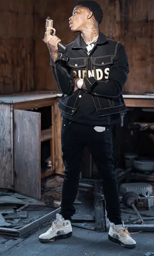 Quando Rondo wearing Vlone jacket
