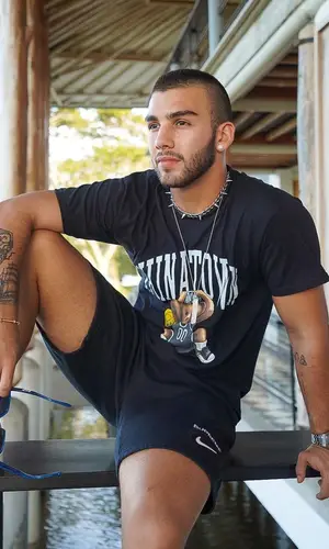Manuel Turizo wearing Supreme shorts