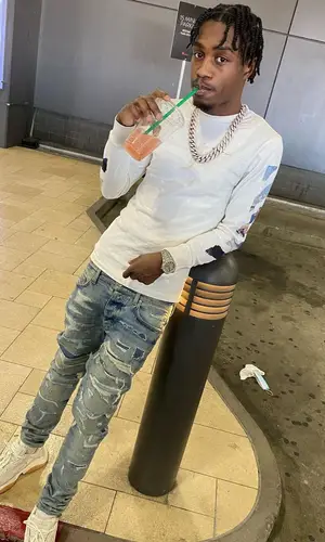 Lil Tjay wearing Off-White top