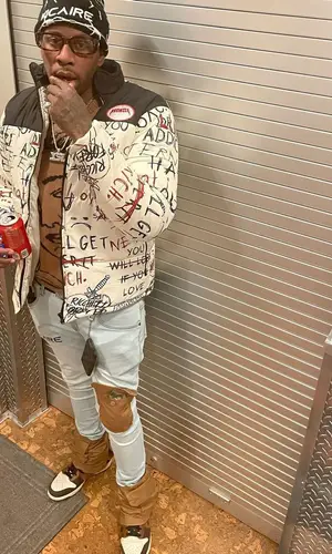 Lil Duke wearing Louis Vuitton other