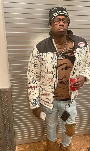 Lil Duke wearing Vicaire hat