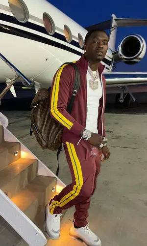 Bankroll Freddie wearing Louis Vuitton backpack