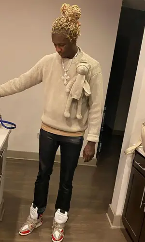 Young Thug wearing Louis Vuitton sweater