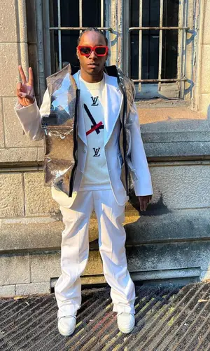 Bloody Osiris wearing Louis Vuitton sweater