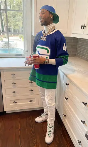 Key Glock wearing Fanatics jersey