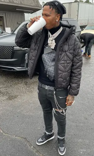 Moneybagg Yo wearing Louis Vuitton bag