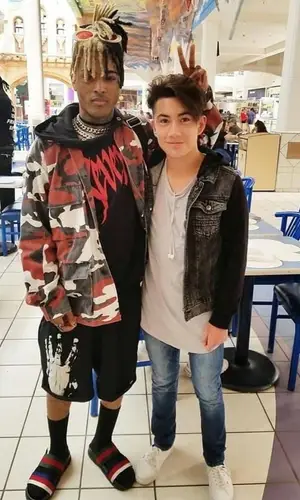 XXXTentacion wearing XXXTentacion Merch shorts