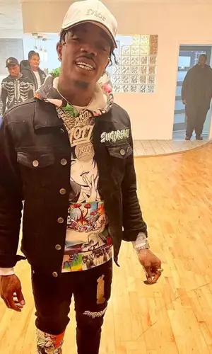 Foogiano wearing Sugarhill pants