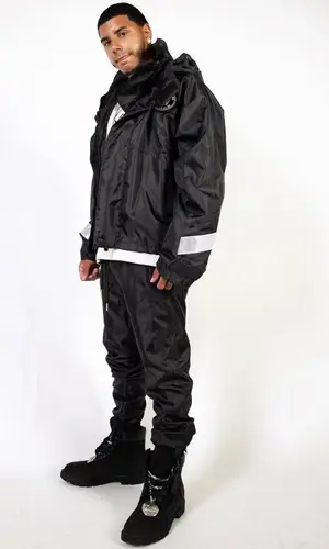 CJ wearing Karl Kani jacket