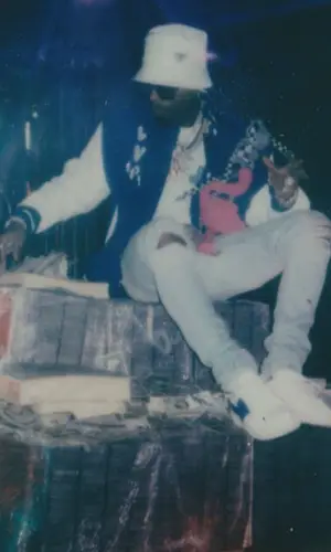 Tory Lanez wearing Prada pants