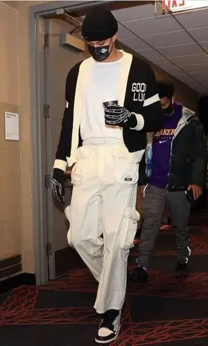 Kyle Kuzma wearing Mr. Saturday sweater