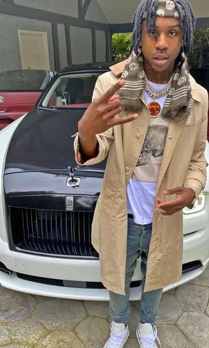Polo G wearing Alexander McQueen scarf