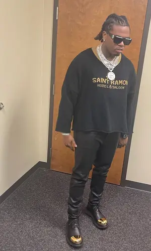 Gunna wearing Saint Ramon Never Die sweater
