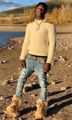 NBA YoungBoy wearing Saint Laurent boots
