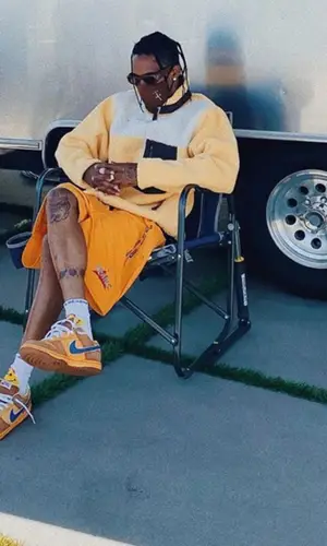 Travis Scott wearing Cactus Jack shorts