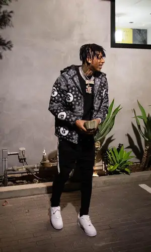 NLE Choppa wearing Nike pants