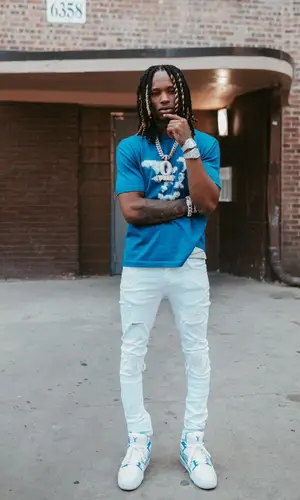 King Von wearing Amiri jeans