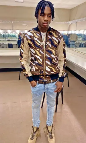 Polo G wearing Louis Vuitton boots
