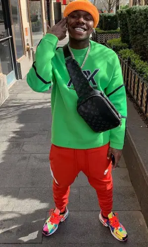 DaBaby wearing Armani Exchange sweater