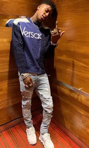 NBA YoungBoy wearing Versace sweater
