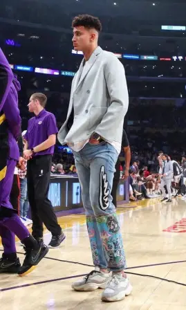 Kyle Kuzma wearing OAMC suit