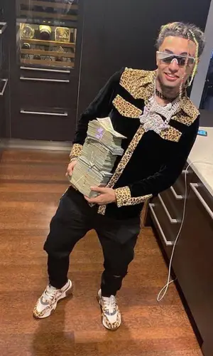 Lil Pump wearing Garcons Infideles shirt