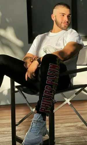Manuel Turizo wearing Philipp Plein pants