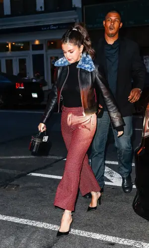 Selena Gomez wearing Selena Gomez Merch jacket