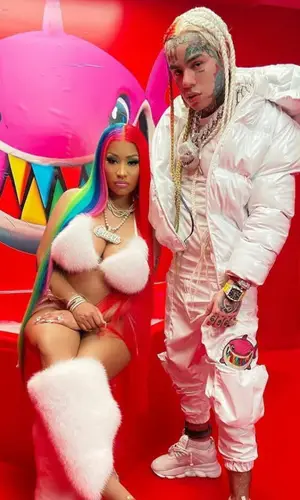 6ix9ine wearing 6ix9ine Merch pants