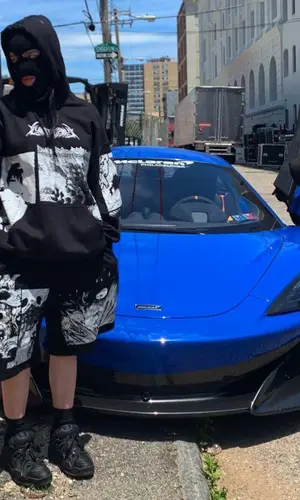 Billie Eilish’s Outfit in Ghostsupply Hoodie, Under Armour Sneakers & Fashion Criminal Hat (2020)