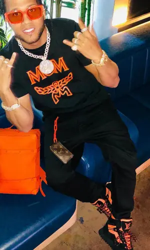 El Alfa El Jefe wearing Louis Vuitton boots