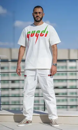 Karim Benzema wearing Gucci trousers
