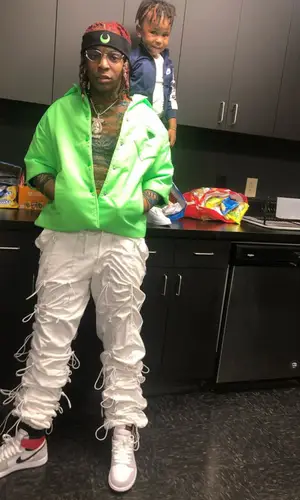 Lil Gotit wearing Marine Serre other