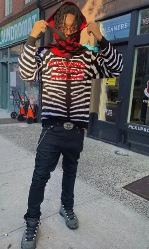 Lil Tecca wearing Alexander McQueen scarf