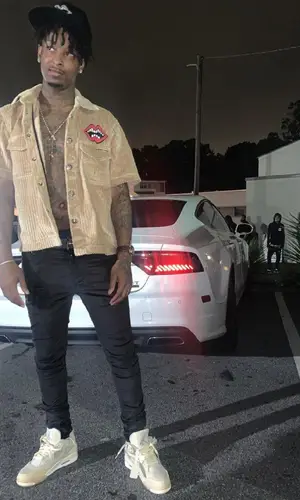 21 Savage wearing Chrome Hearts cap