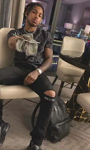 DDG wearing Louis Vuitton backpack