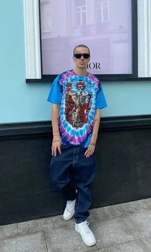 Face wearing Liquid Blue t-shirt