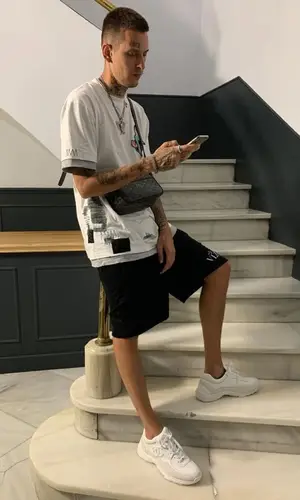 Kizaru wearing Valentino shorts