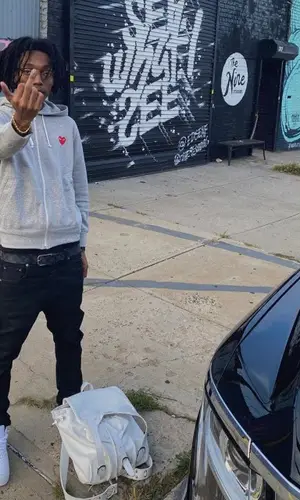 Lil Tecca wearing Comme Des Garcons hoody
