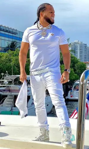 El Alfa El Jefe wearing Versace top
