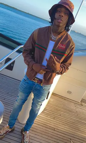 Polo G wearing Gucci hat