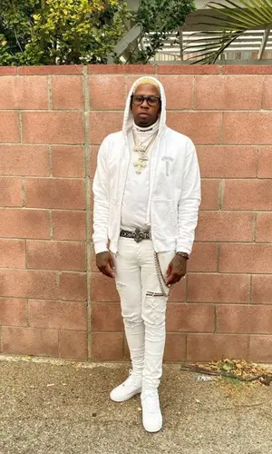 Lil Duke wearing Amiri jeans