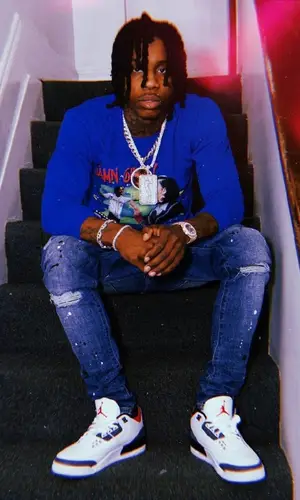 Polo G wearing Polo G Merch top