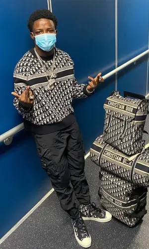 Jackboy wearing Dior backpack