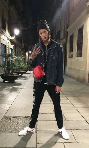 Kizaru wearing Tommy Hilfiger jacket