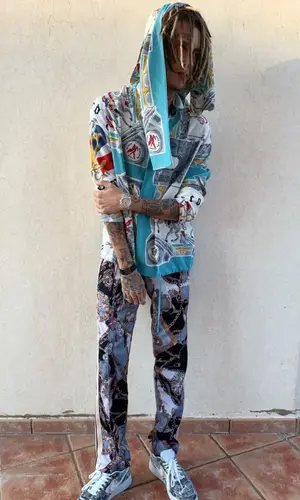 Kizaru wearing Palm Angels pants